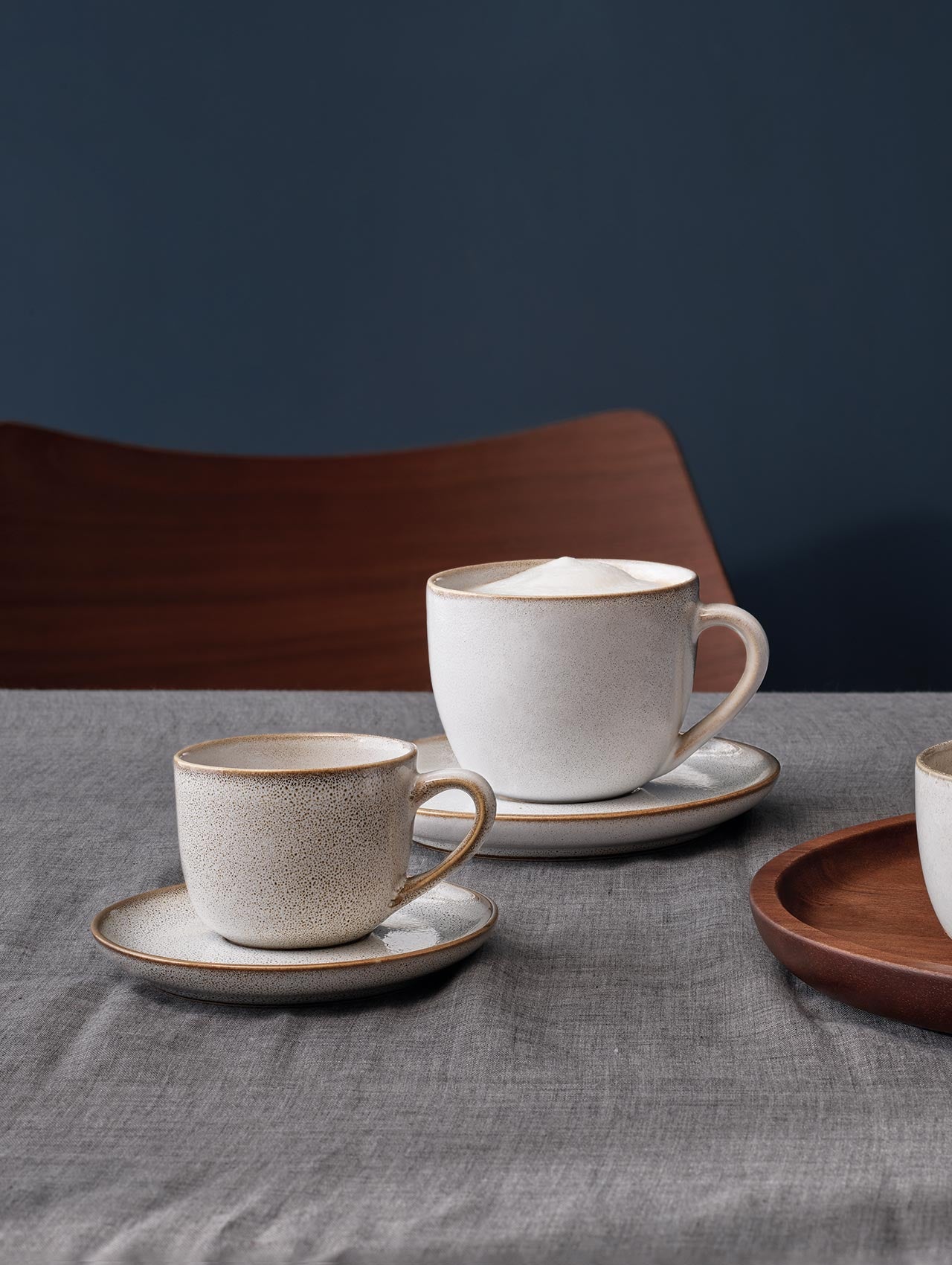 cappuccino cup with saucer, sand